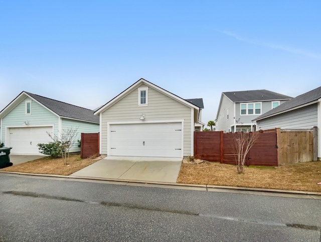 view of front of property featuring a garage and an outdoor structure