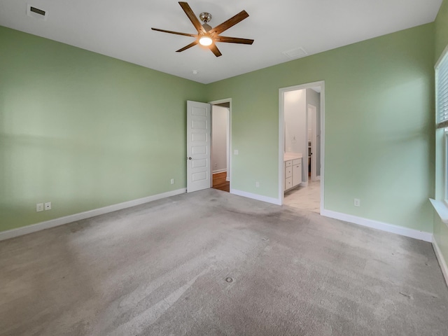 unfurnished room featuring light carpet and ceiling fan