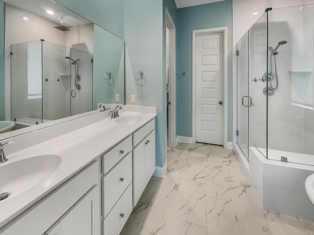 bathroom with vanity and independent shower and bath