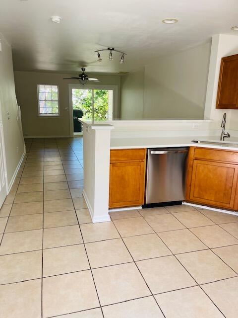 145 Taylor Cir, Goose Creek, SC 29445 - kitchen featuring dishwasher, a sink, light countertops, light tile patterned floors, and ceiling fan
