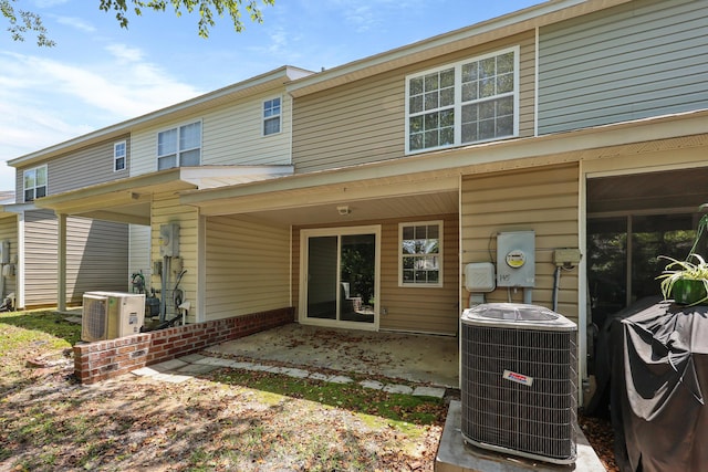 145 Taylor Cir, Goose Creek, SC 29445 - rear view of house with central AC, a patio area, ac unit, and brick siding