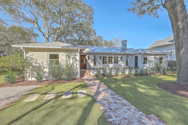 ranch-style home featuring a front yard