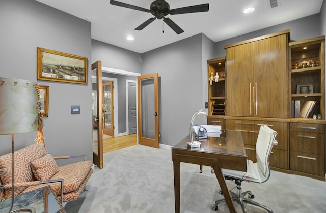 office space featuring recessed lighting, light carpet, a ceiling fan, baseboards, and french doors