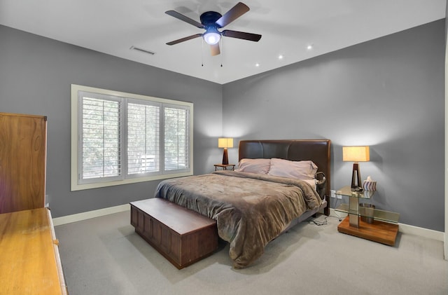 bedroom with baseboards, visible vents, ceiling fan, and carpet flooring