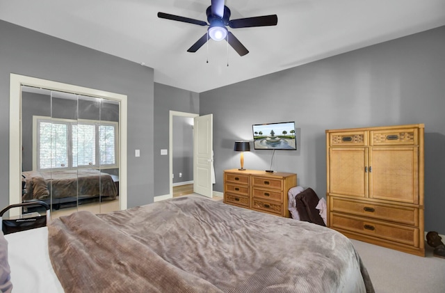 carpeted bedroom featuring ceiling fan