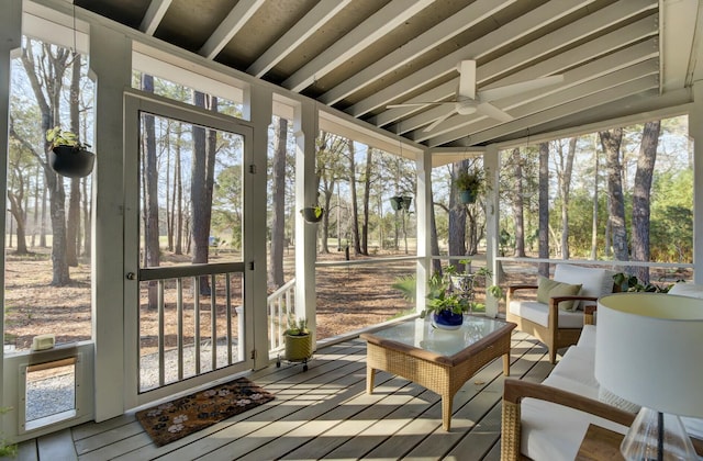 sunroom / solarium with plenty of natural light and ceiling fan