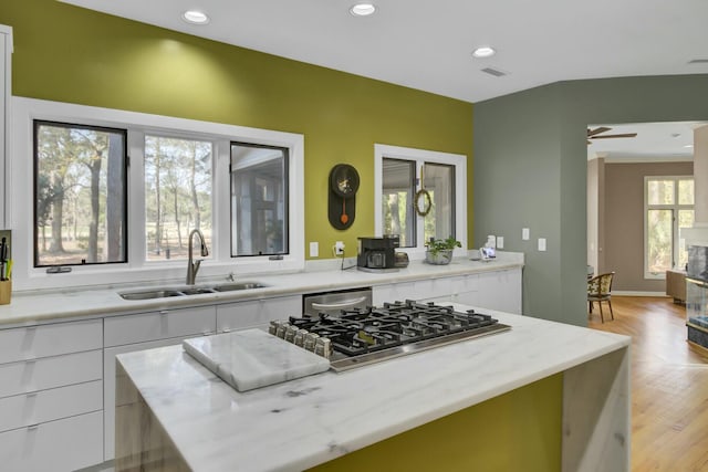 kitchen featuring recessed lighting, a sink, visible vents, white cabinets, and appliances with stainless steel finishes