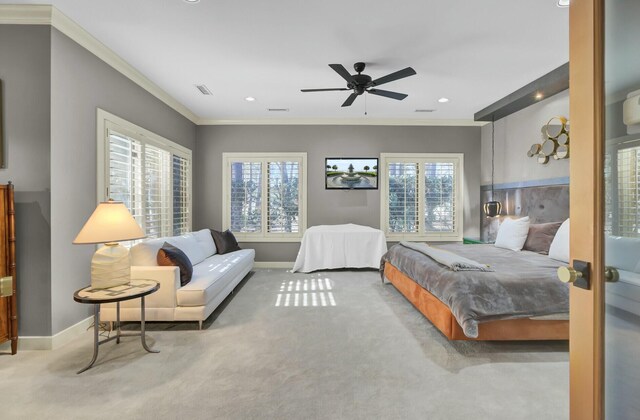 bedroom featuring multiple windows, carpet, and crown molding