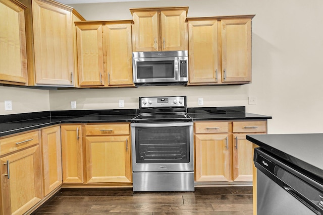 kitchen with light brown cabinetry, appliances with stainless steel finishes, and dark hardwood / wood-style floors