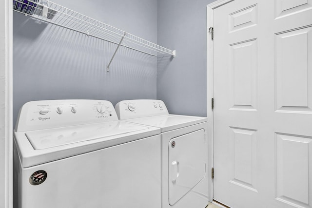 laundry room with independent washer and dryer