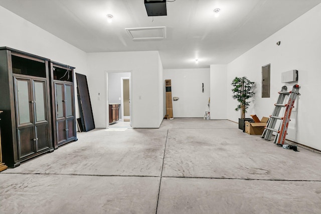 garage featuring a garage door opener and electric panel