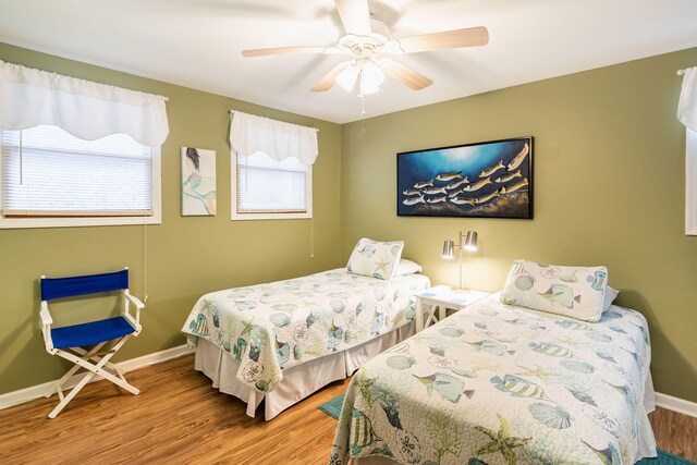 bedroom featuring ceiling fan and hardwood / wood-style floors