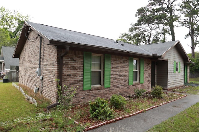 814 Armsway St, Mount Pleasant, SC 29464 - view of home's exterior with brick siding, a yard, and a shingled roof