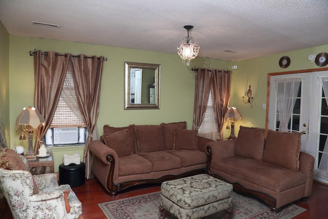 814 Armsway St, Mount Pleasant, SC 29464 - living area with wood finished floors, a textured ceiling, cooling unit, and a chandelier
