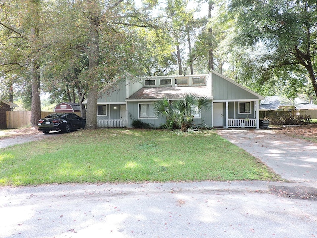 view of front of property with a front yard and a porch