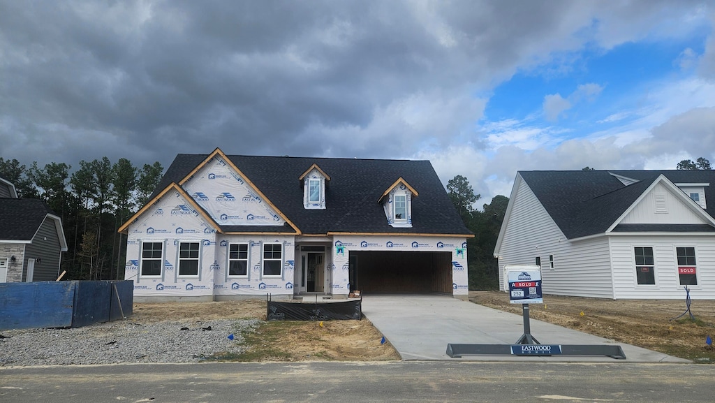 property in mid-construction with a garage