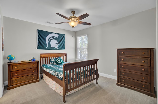 bedroom featuring light carpet and ceiling fan