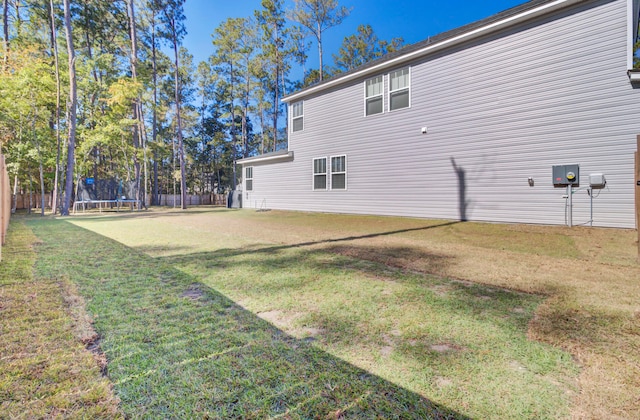 exterior space with a yard and a trampoline