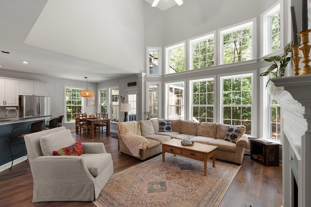 3574 Toomer Kiln Cir, Mount Pleasant, SC 29466 - living room featuring dark wood-style floors, a ceiling fan, a high ceiling, and recessed lighting