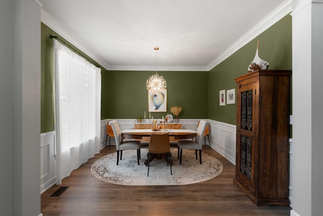 3574 Toomer Kiln Cir, Mount Pleasant, SC 29466 - dining room featuring ornamental molding, wood finished floors, a wainscoted wall, and a chandelier
