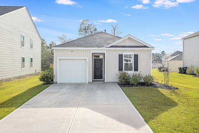 view of front facade with a garage and a front yard