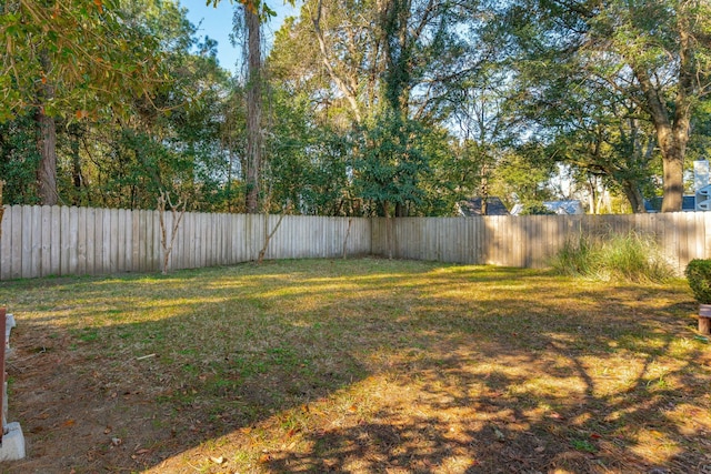 view of yard with a fenced backyard