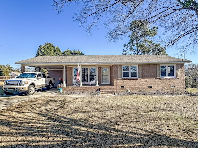 single story home featuring a carport and covered porch