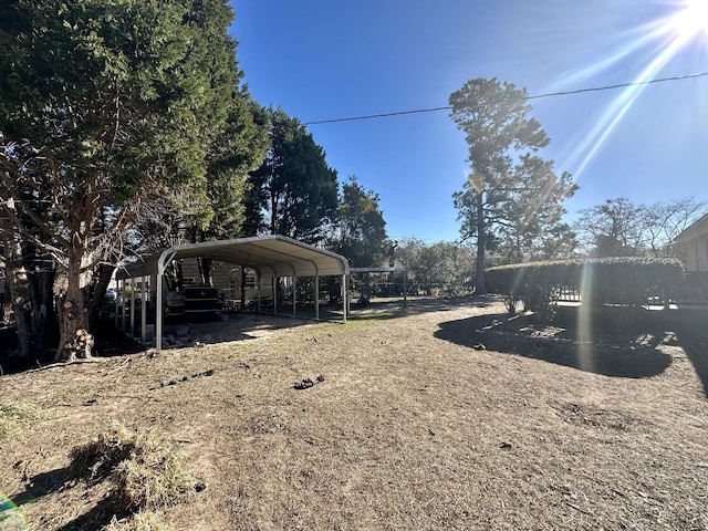 view of yard with a carport