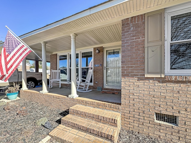 doorway to property with covered porch