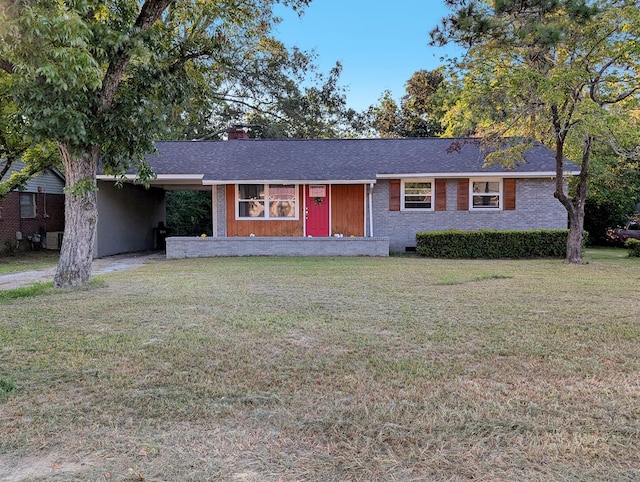 ranch-style home featuring a front yard and a carport