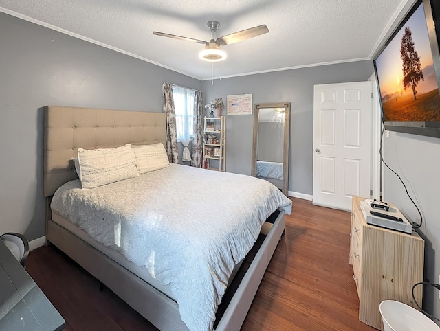 bedroom featuring a textured ceiling, ceiling fan, dark hardwood / wood-style floors, and crown molding