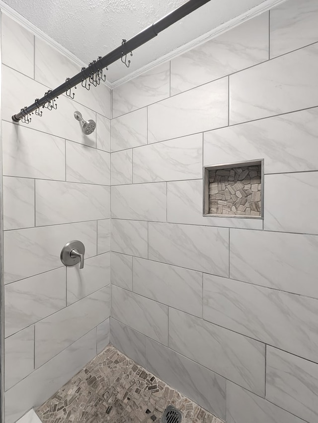 bathroom with tiled shower