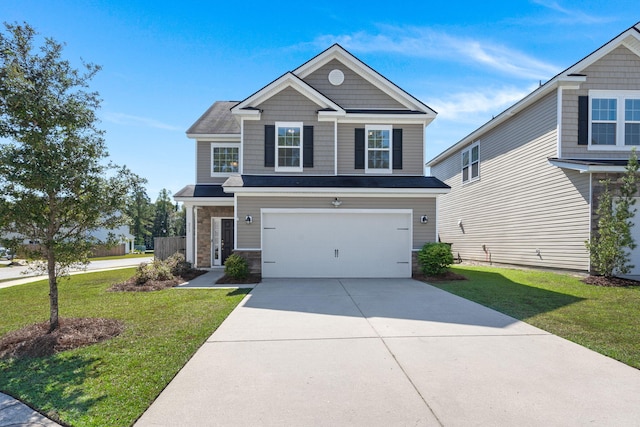 view of front of property with a front lawn and a garage