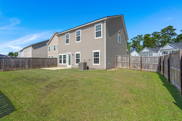 back of property featuring a patio and a yard