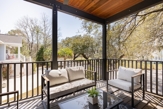 wooden deck featuring an outdoor living space