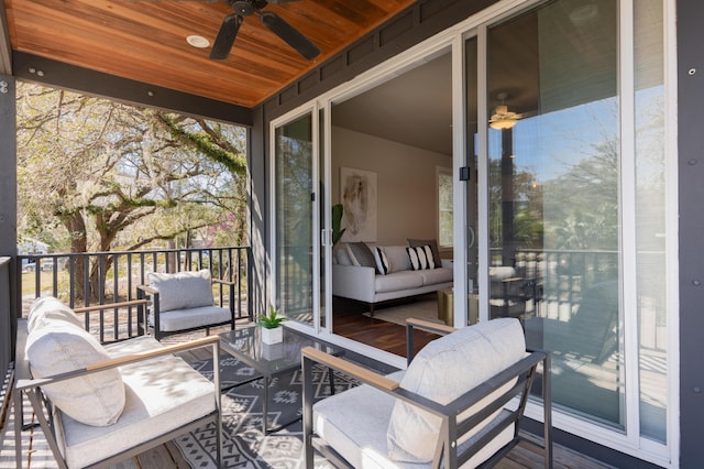 exterior space with outdoor lounge area and ceiling fan