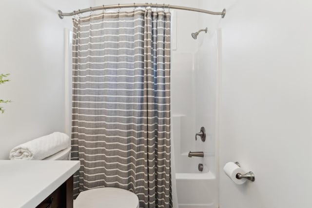 full bathroom featuring toilet, vanity, and shower / bath combination with curtain