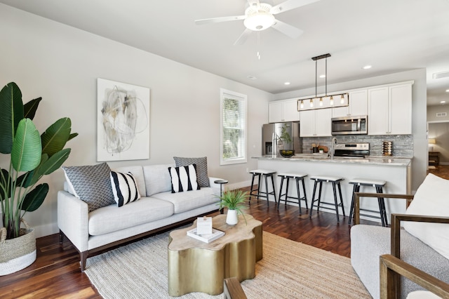 living area featuring recessed lighting, visible vents, ceiling fan, and dark wood-style flooring