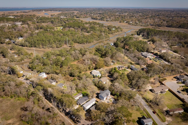 birds eye view of property featuring a forest view