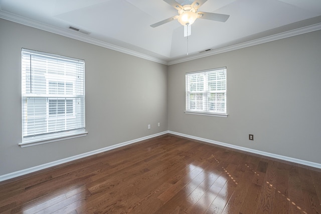 unfurnished room featuring visible vents, dark wood finished floors, and baseboards