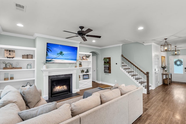 3873 Hanoverian Dr, Mount Pleasant, SC 29429 - living area with ornamental molding, recessed lighting, stairway, dark wood-style floors, and a fireplace with flush hearth