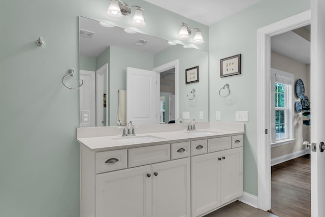 3873 Hanoverian Dr, Mount Pleasant, SC 29429 - bathroom with double vanity and baseboards