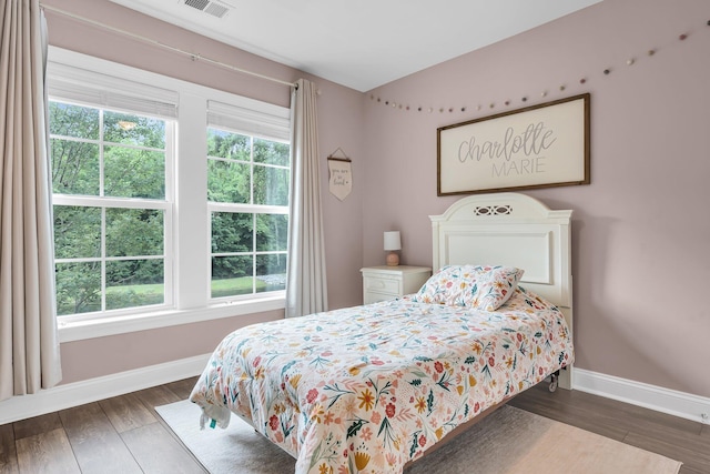 3873 Hanoverian Dr, Mount Pleasant, SC 29429 - bedroom featuring multiple windows, baseboards, and wood finished floors