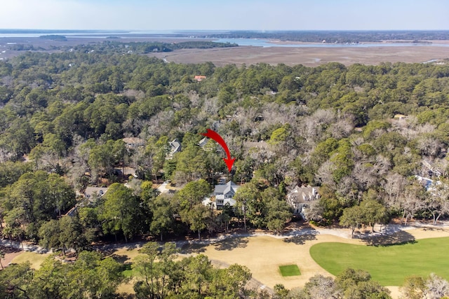 bird's eye view featuring a wooded view