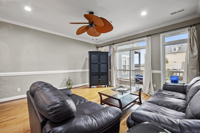 81 Sandbar Ln Unit 23, Folly Beach, SC 29439 - living room with a ceiling fan, wood finished floors, crown molding, and recessed lighting