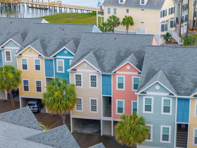 81 Sandbar Ln Unit 23, Folly Beach, SC 29439 - view of front facade with a shingled roof and a water view