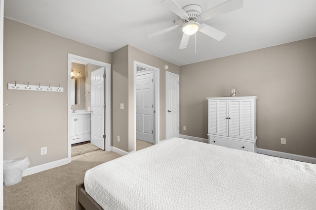 81 Sandbar Ln Unit 23, Folly Beach, SC 29439 - bedroom featuring light carpet, ensuite bath, and ceiling fan