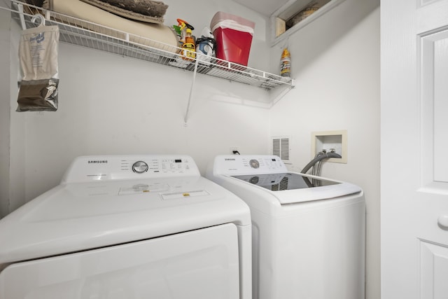 81 Sandbar Ln Unit 23, Folly Beach, SC 29439 - washroom featuring washing machine and dryer