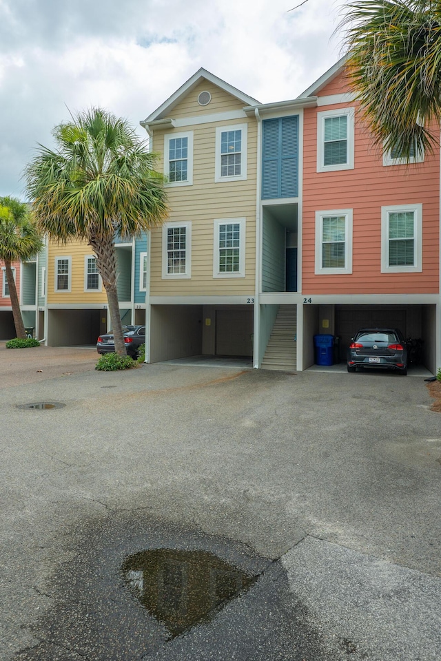 81 Sandbar Ln Unit 23, Folly Beach, SC 29439 - view of property featuring a garage and driveway