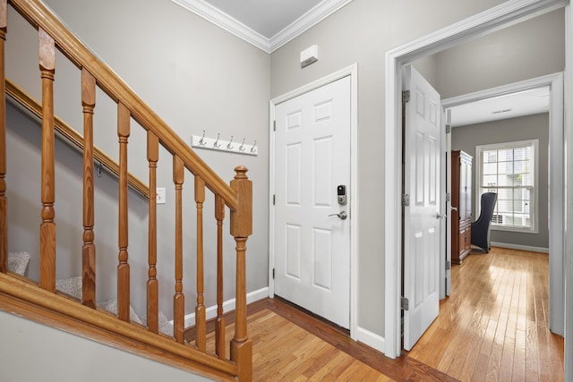81 Sandbar Ln Unit 23, Folly Beach, SC 29439 - foyer with light wood-style floors, ornamental molding, and stairway